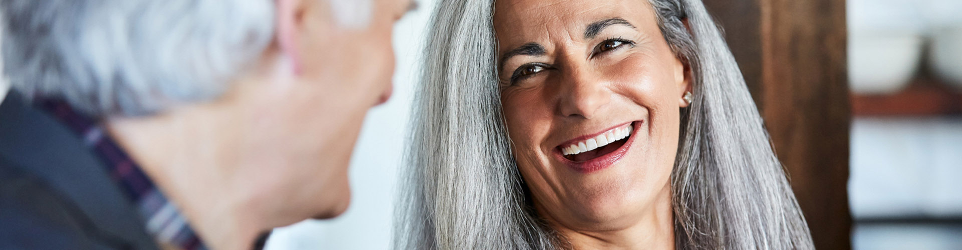 elderly couple laughing together